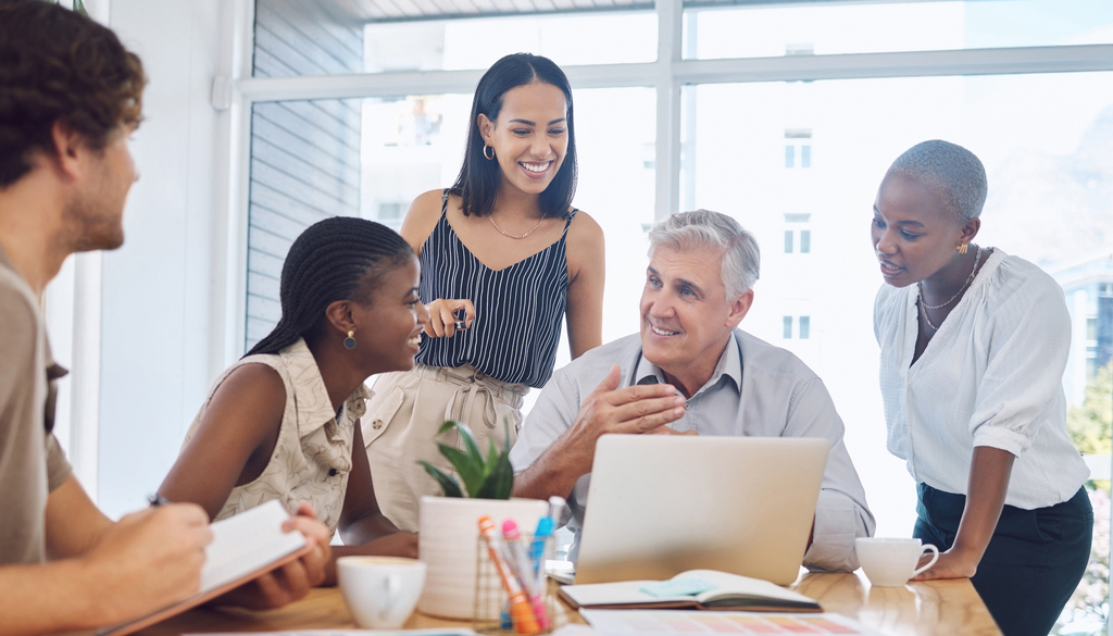 Nonprofit team collaborating around a laptop
